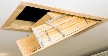 Chilling video captures the moment armed man who'd served time for homicide is found hiding in family's attic