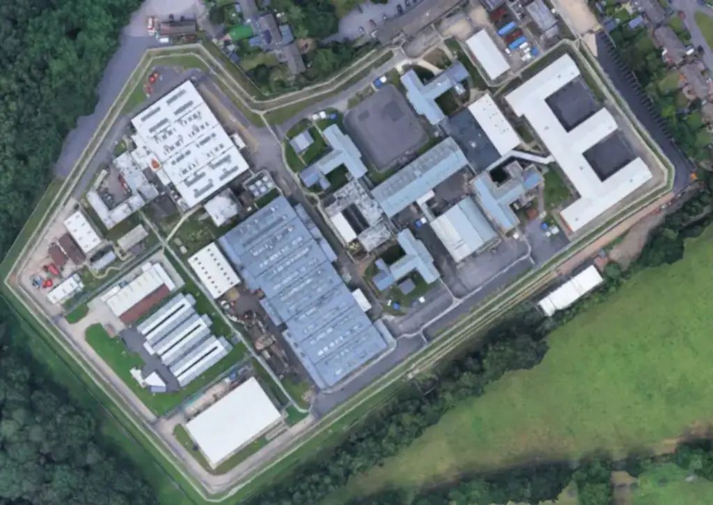 A former prison officer has been jailed for having romantic relationships with two inmates at HMP Coldingley. Credit: Google Maps