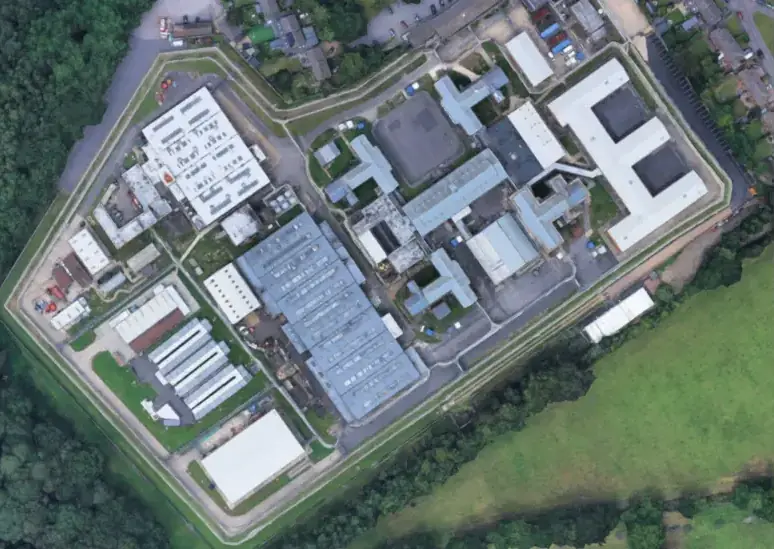 A former prison officer has been jailed for having romantic relationships with two inmates at HMP Coldingley. Credit: Google Maps
