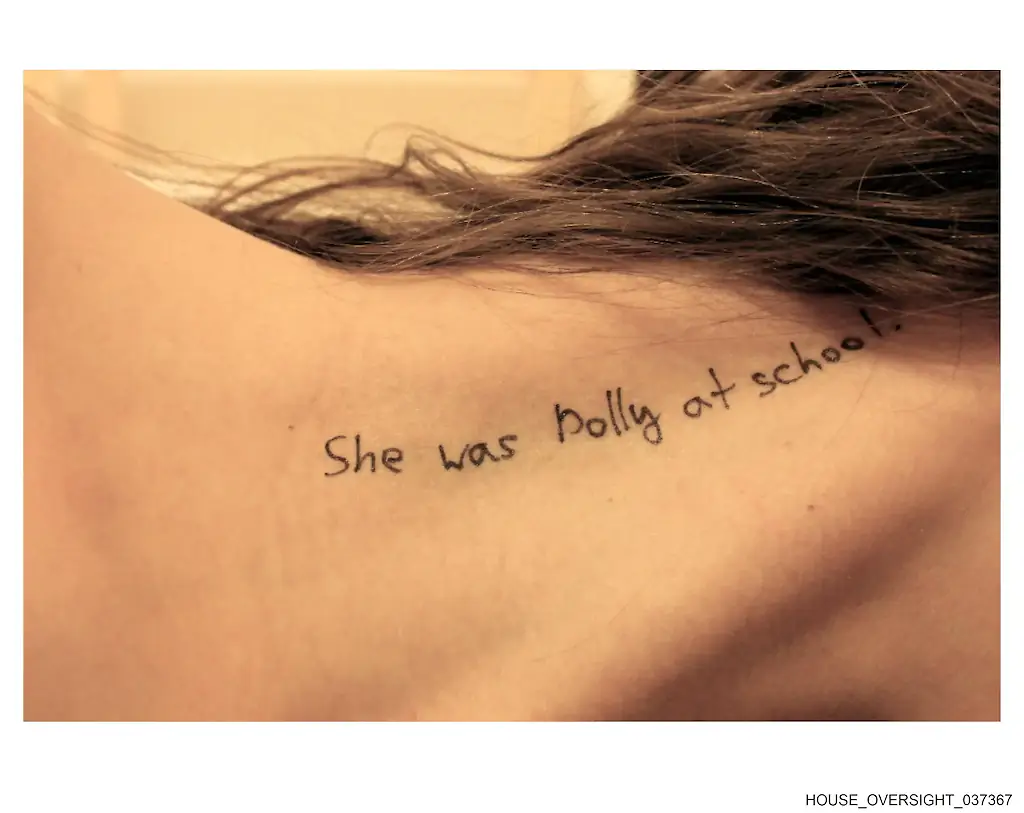 Lines from the book Lolita scribbled on a person’s neck. Credit: House Oversight Committee
