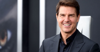 Tom Cruise poses with two of his children as he shares first public photo together in 15 years