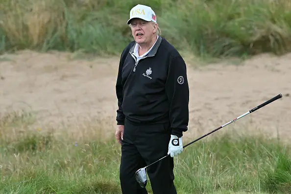 Donald Trump playing golf. Credit: ANDY BUCHANAN/AFP via Getty Images