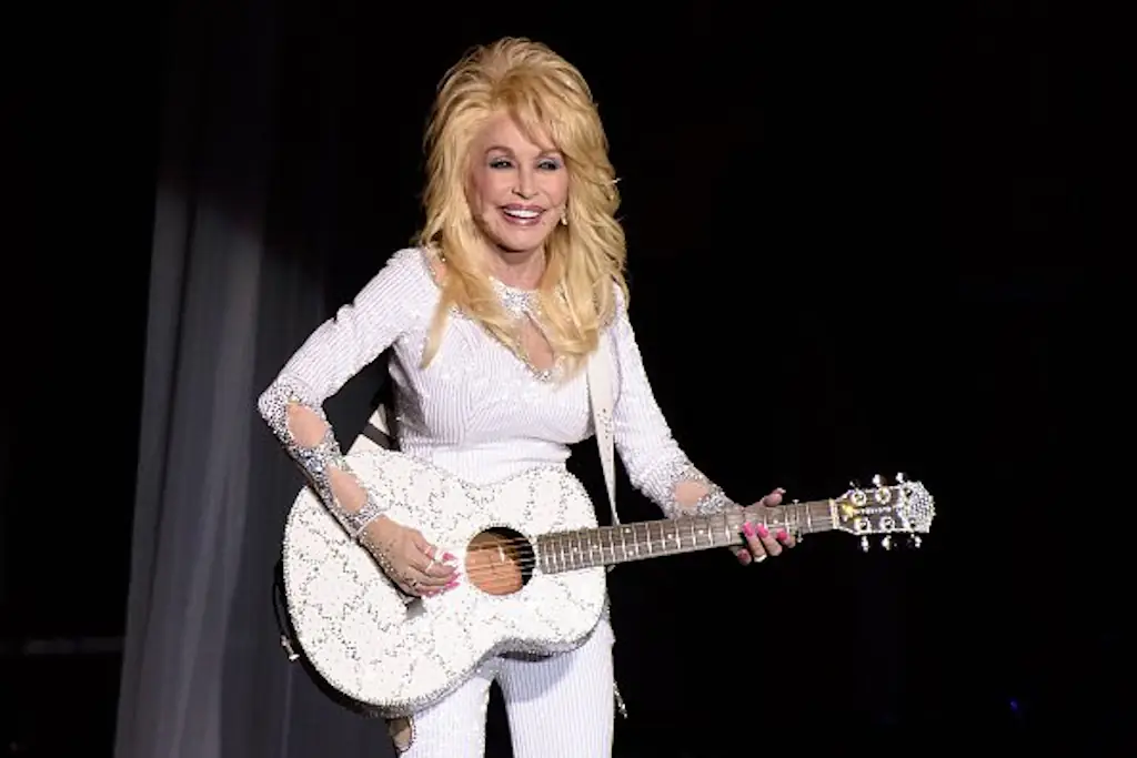 The reason Dolly Parton always wore long sleeves has been revealed. Credit: Daniel Boczarski/Getty Images