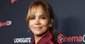 Halle Berry accidentally flashes fans in hilarious video of her trying to remove super-tight dress