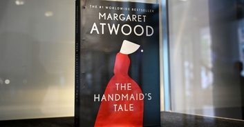 Moment Idaho high school graduate refuses to shake superintendent’s hand and drops a copy of 'The Handmaid's Tale' at his feet