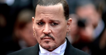 Johnny Depp appears to unveil new smile after fan criticised his natural teeth