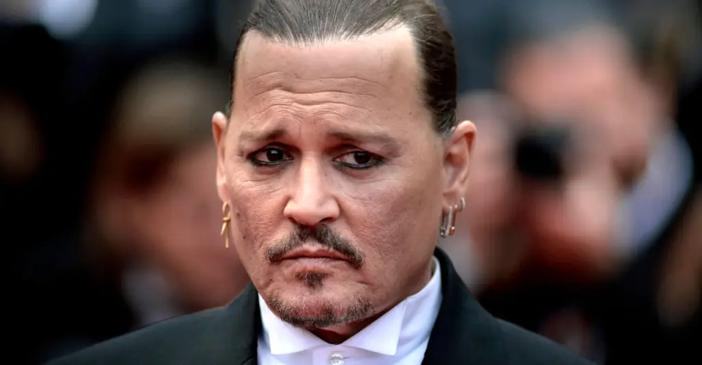 Johnny Depp appears to unveil new smile after fan criticised his natural teeth