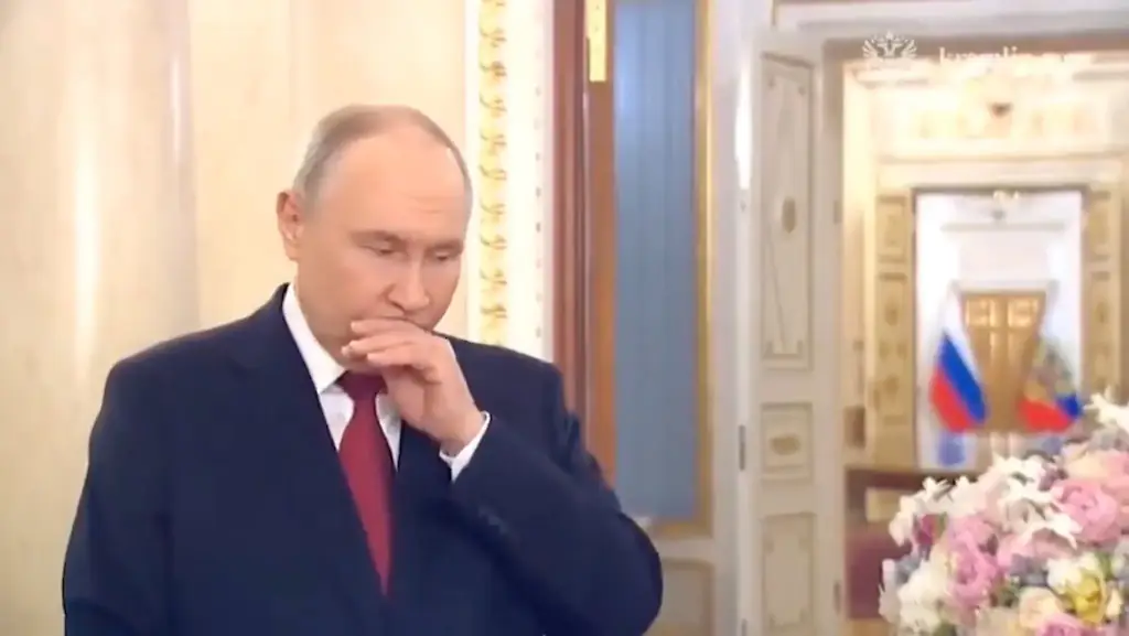 Vladimir Putin could be seen struggling with a coughing fit. Credit: Kremlin