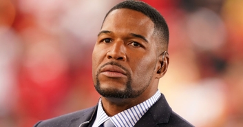 Michael Strahan speaks out over national anthem controversy as he is seen 'throwing reporter's phone'