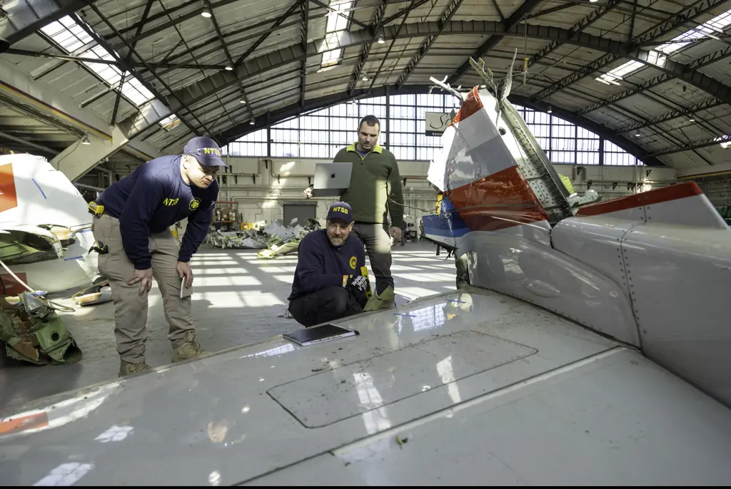 New photos of American Airlines plane wreckage as investigation begins into crash that killed 67