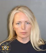 Colorado woman arrested after dementia-stricken mother, 76, is mauled to death in home more than 50 neglected dogs