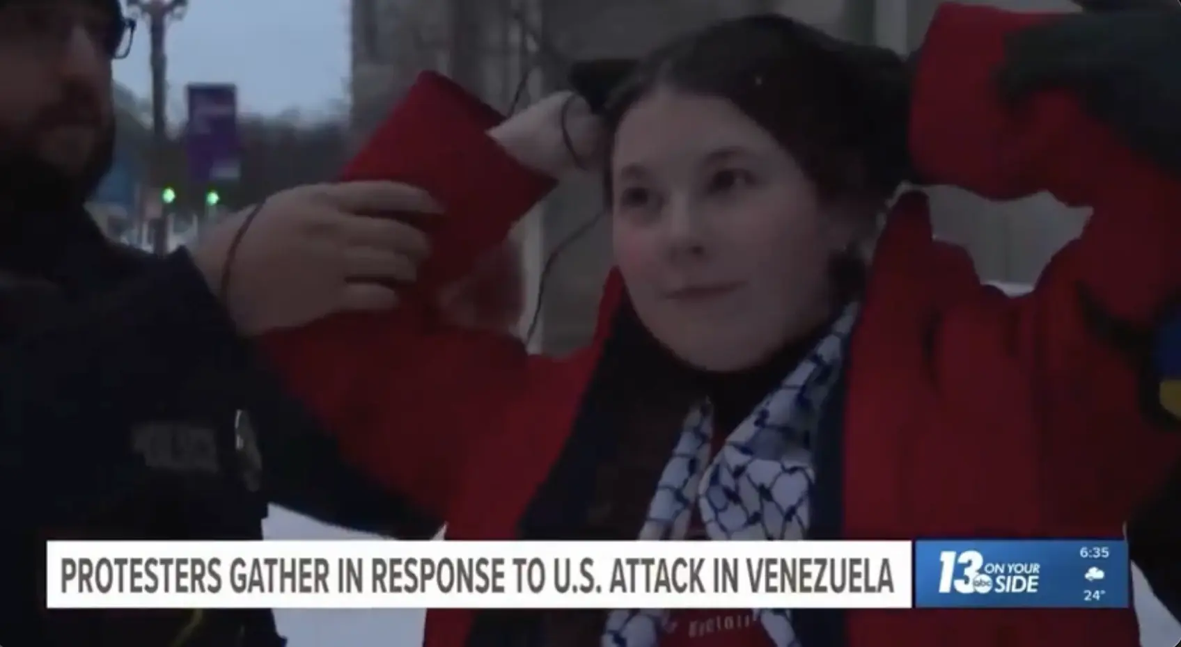 The protester was arrested on live TV. Credit: ABC13