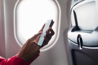 American Airlines flight is forced to turn around after nosy passenger spotted alarming 3-letter message on stranger's phone
