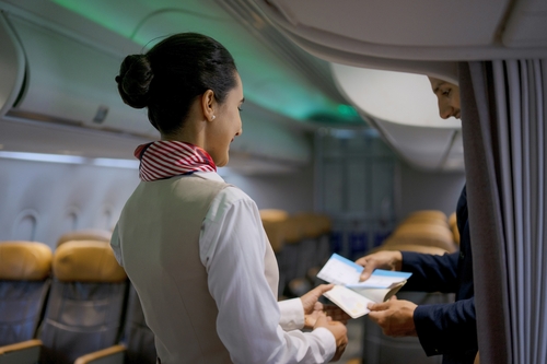 Flight attendant shares real reason cabin crew say greet passengers as they board