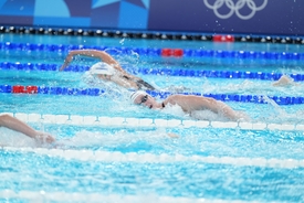 Olympic swimmer collapses after race and is seen being carried away on a stretcher