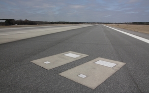 Reason why two people are buried in graves under airport's busy runway