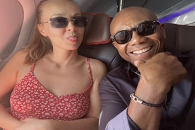 Black ex-cop, 63, and white wife, 34, left horrified and 'humiliated' by what happened moments after taking selfie on flight