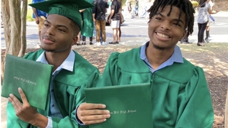 Firefighter charged after allegedly sharing images of twin brothers who died of gunshot wounds on mountain
