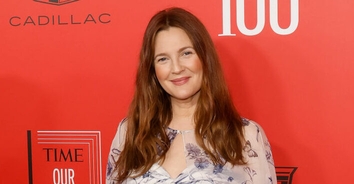 Drew Barrymore says the first memory of her father was when he threw her against a wall when she was 3