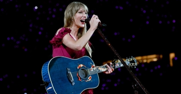Taylor Swift cowers as fans throw objects at her at concert