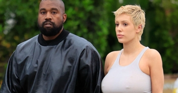 Kanye West's 'wife' covers up with a cushion in public after reportedly angering Italian locals