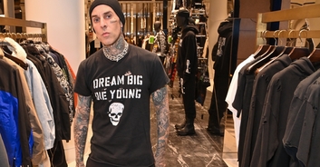 Travis Barker poses with his wax figure - but no one can tell which is the real Travis