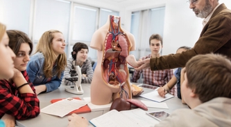 Teacher praised for giving students an anatomy lesson in a full body suit that maps out the human body in detail