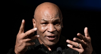 Bizarre footage shows Mike Tyson cradling Hasbulla like a baby and appearing to 'nibble' his ear
