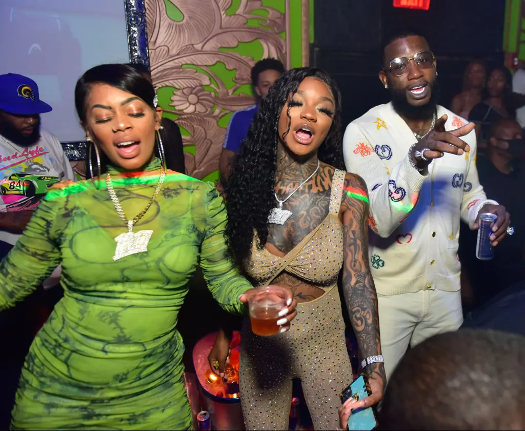 Enchanting (middle) with her former record label CEO, Gucci Mane. Credit: Prince Williams / Getty