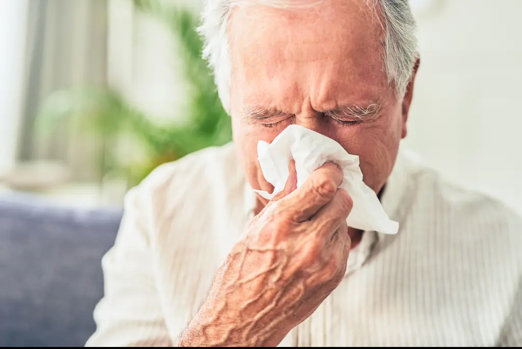 The man sneezed and coughed at the same time. Credit: Moyo Studio/Getty