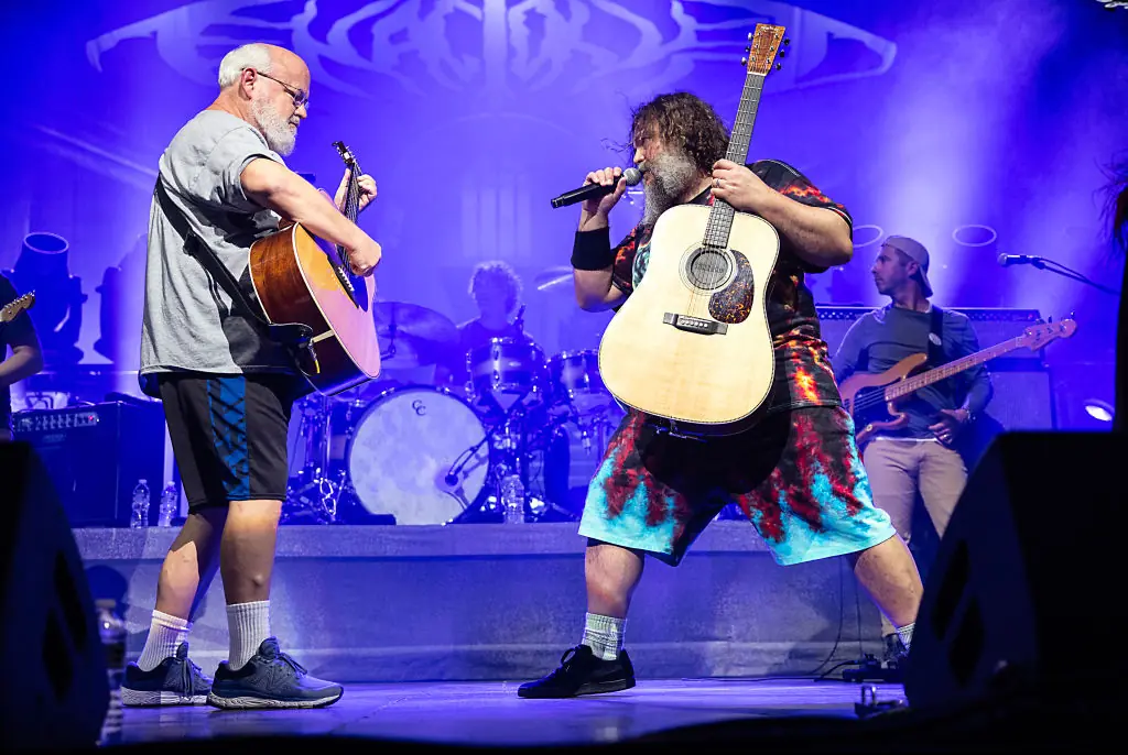 Kyle Gass and Jack Black performing on stage as Tenacious D. Credit: Jeff Hahne  / Getty