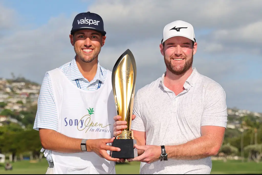 Murray with his caddie Jay Green after winning Sony Open in Hawaii in January. Credit: Michael Reaves / Getty