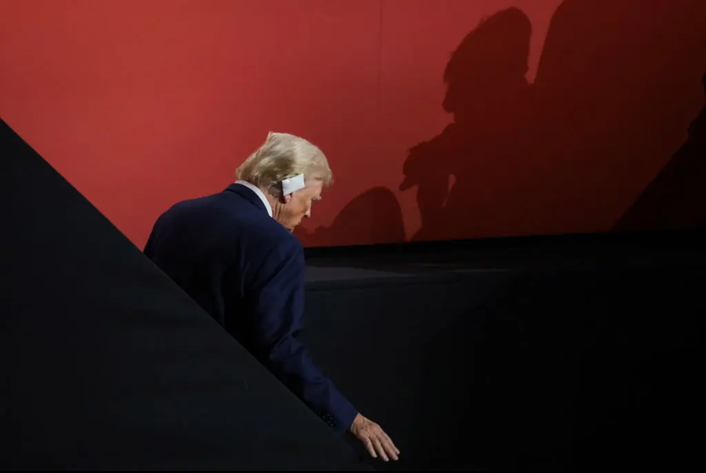 Donald Trump has started wearing an ear bandage. Credit:  Scott Olson/Getty