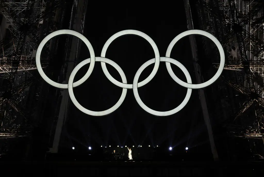 Celine Dion performs on the Eiffel Tower at the conclusion of the opening ceremony of the Olympic Games. Credit: Pascal Le Segretain/Getty 