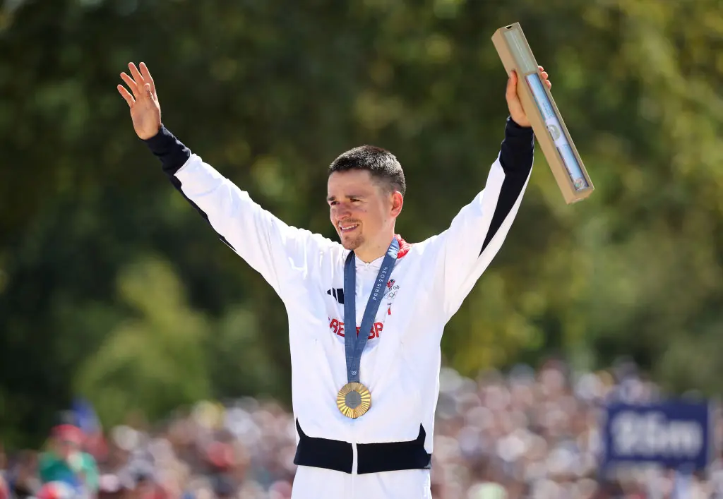 Gold medalist Thomas Pidcock of Team Great Britain poses with the medal and box on the podiumCredit: Jared C. Tilton / Getty