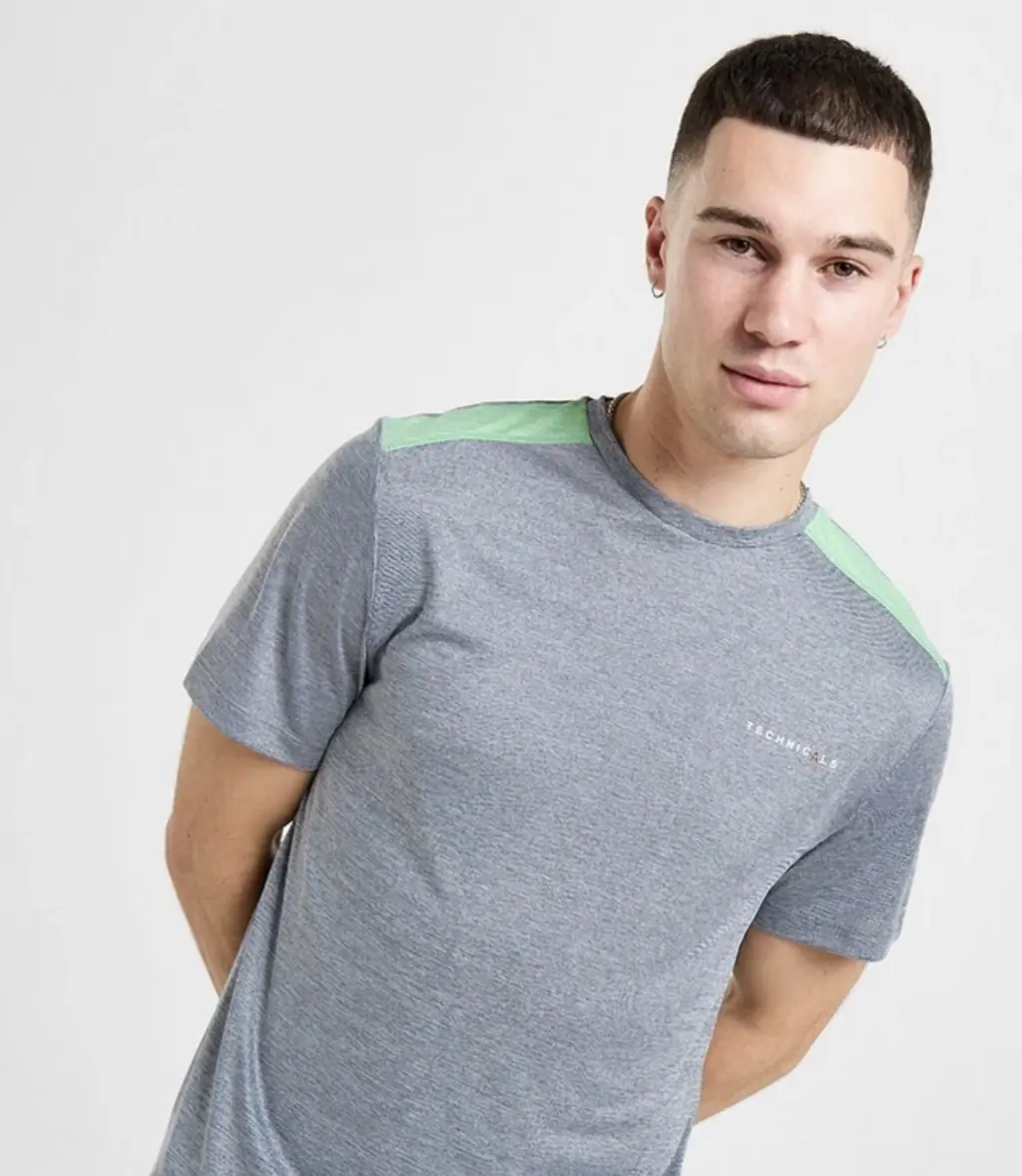 Jay is believed to be wearing a grey and green Technicals shirt. Credit: JD Sports