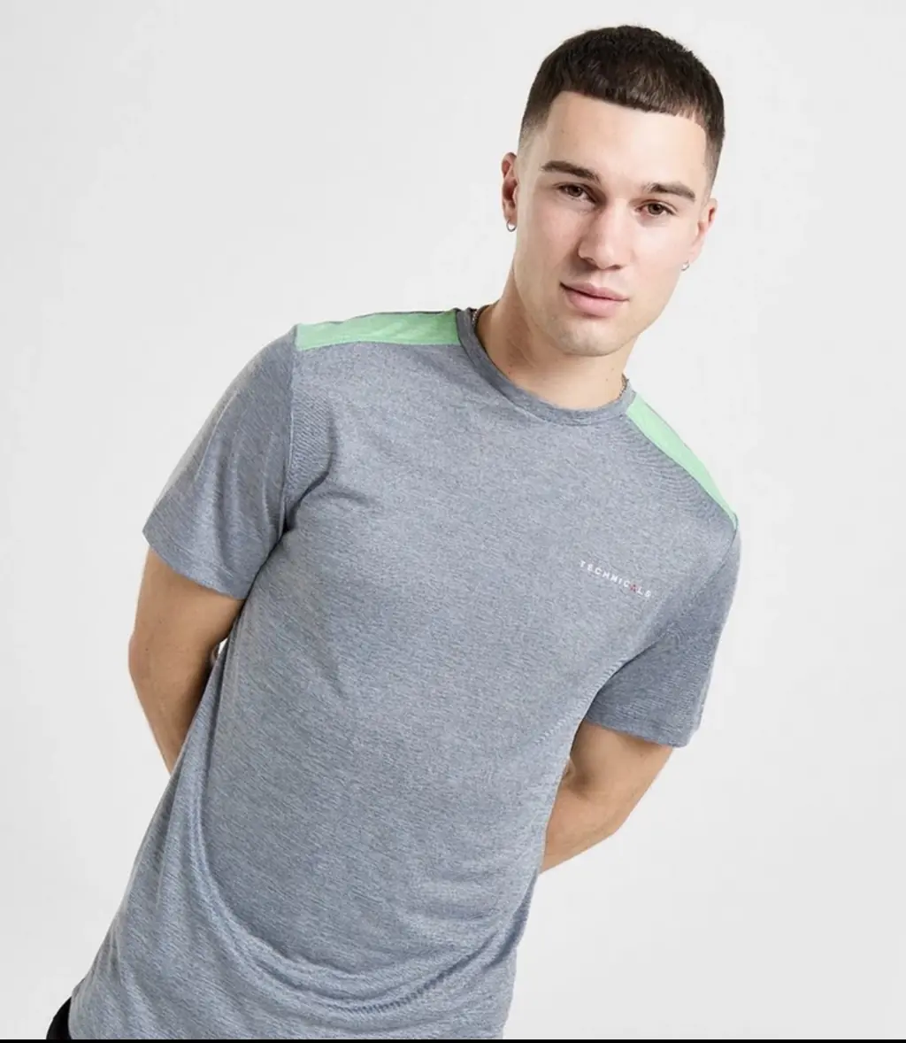 Jay is believed to be wearing a grey and green Technicals shirt. Credit: JD Sports