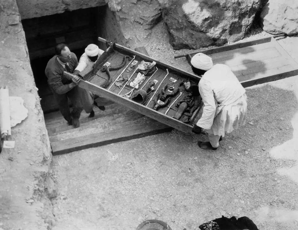 Workers remove a tray of chariot parts from Tutankhamun's tomb in 1922. Credit: Heritage Images / Getty