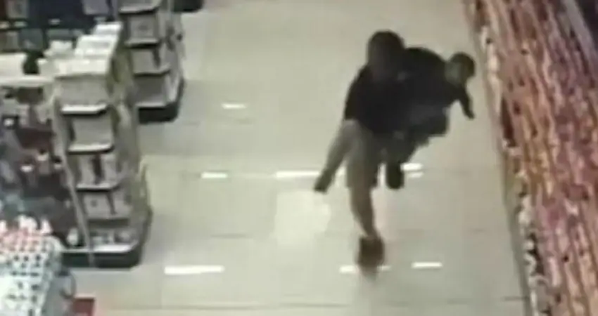 Off-duty cop shoots two robbers while holding his baby boy