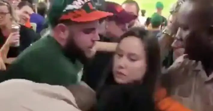 Video shows police officer punching a Miami football fan