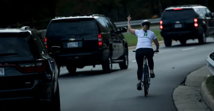 The woman who flipped off Trump's motorcade while on her bike has been fired