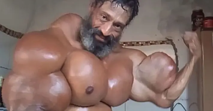 Bodybuilder risks his life by injecting his body with oil in order to achieve 23-inch biceps