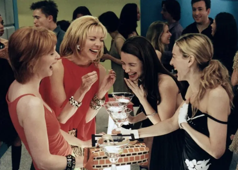 The Sex in the City girls laughing.