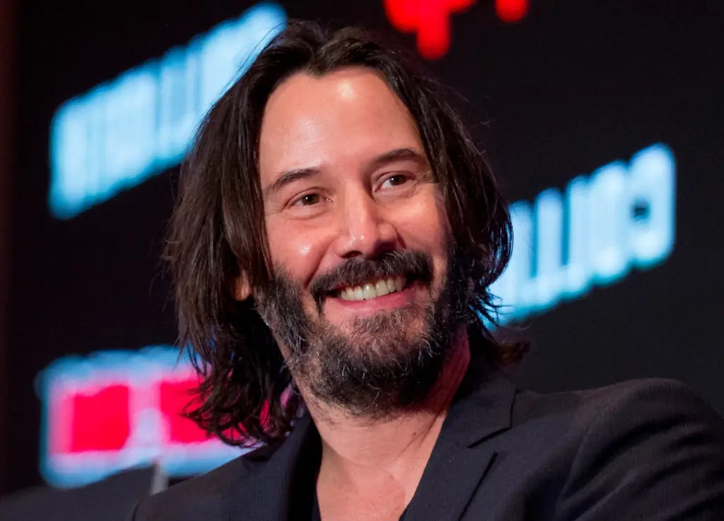 Keanu Reeves smiling.