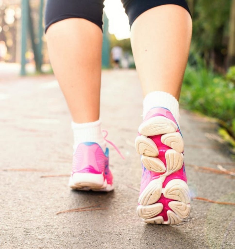 A woman walking fast.