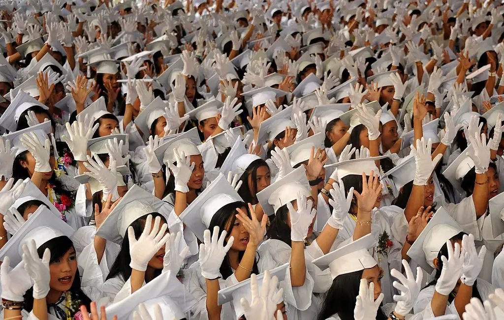 Students of the Batasan Hills High School attend their graduation ceremony.