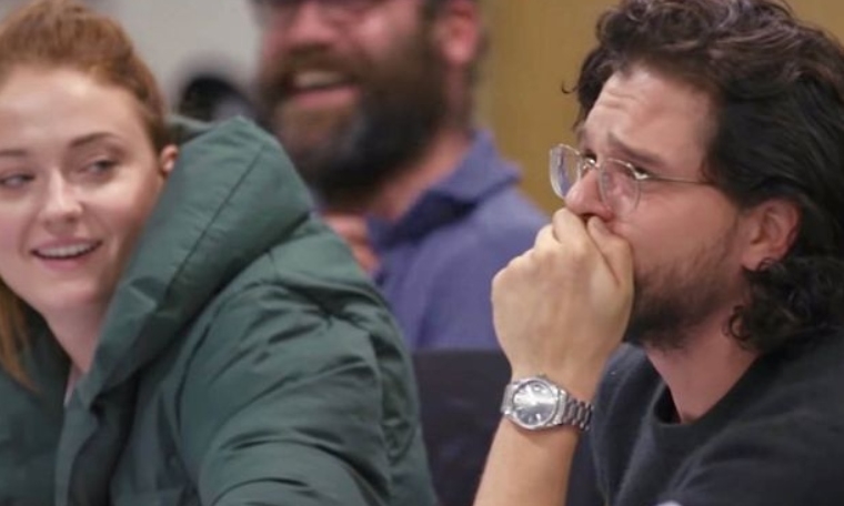 Kit Harington covering his mouth.