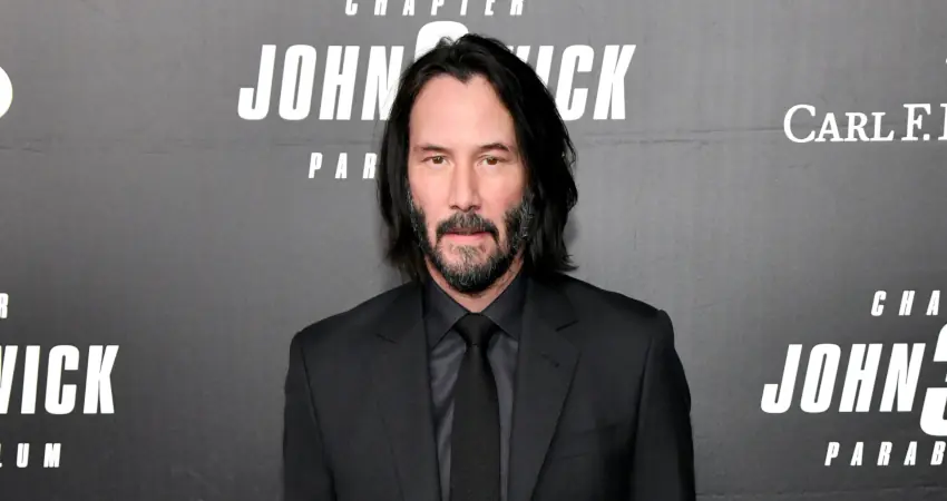 Keanu Reeves spots sign left by fan, immediately jumps out of car to leave adorable note on it