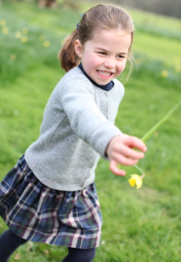 Princess Charlotte holding a daffodil. 