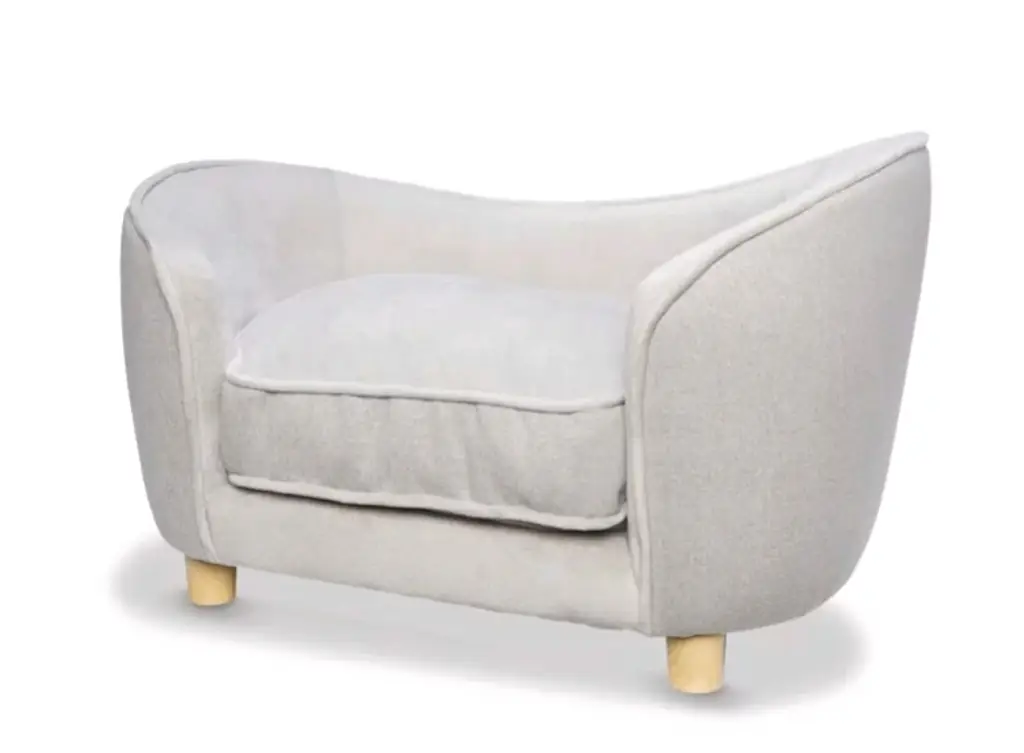 A tiny dog sofa.